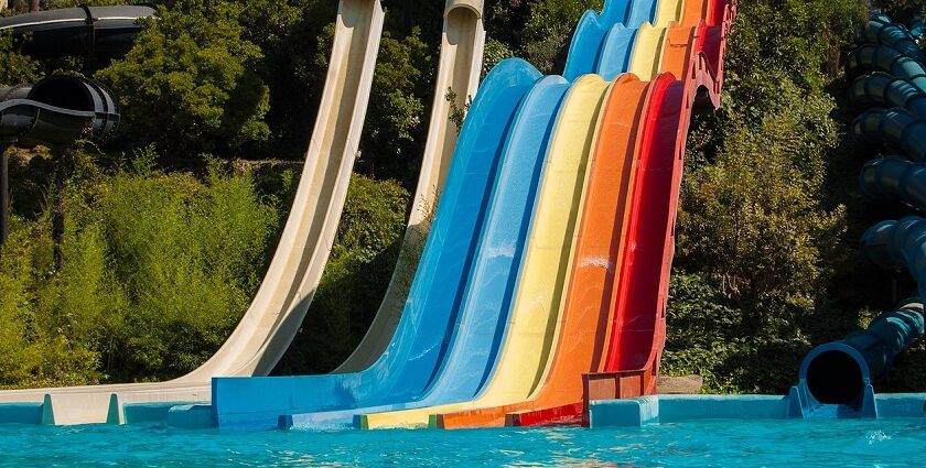 A vibrant view of Mohini Water Park showcasing colourful slides ends in water pools.