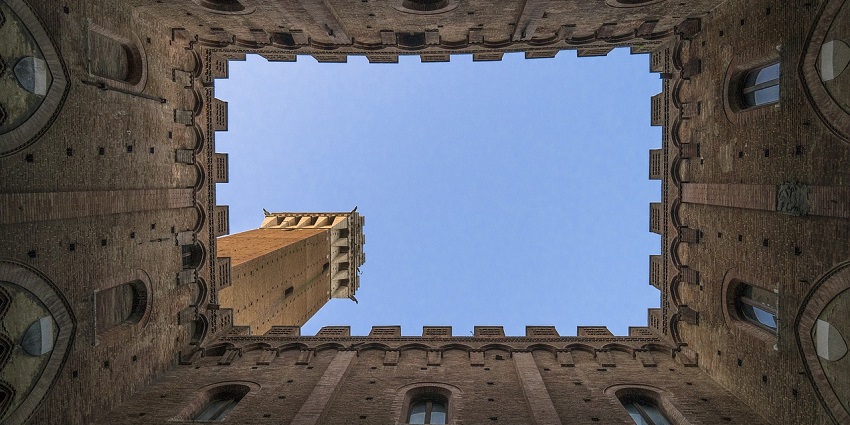 Morgiri Fort stands tall against a bright blue sky, showcasing intricate architecture.