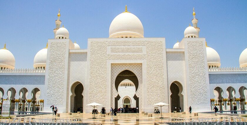 A picture of a traditionally built prayer house for the Muslim people with white walls and domes