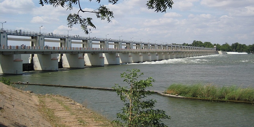 Scenic river view with dam and greenery at Mukkombu, a place near Manachanallur Temple.