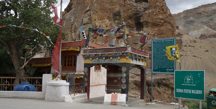 Full view of Mulbekh Monastery, showcasing its unique architecture and mountains.