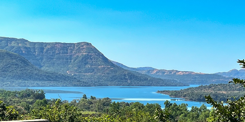 Tranquil view of Mulshi Lake in Maharashtra, reflecting the nature's calm waters.