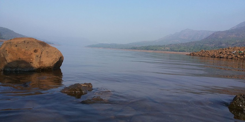 Serene Mulshi Lake with surrounding green hills - one of the places in Maharashtra for weekend.