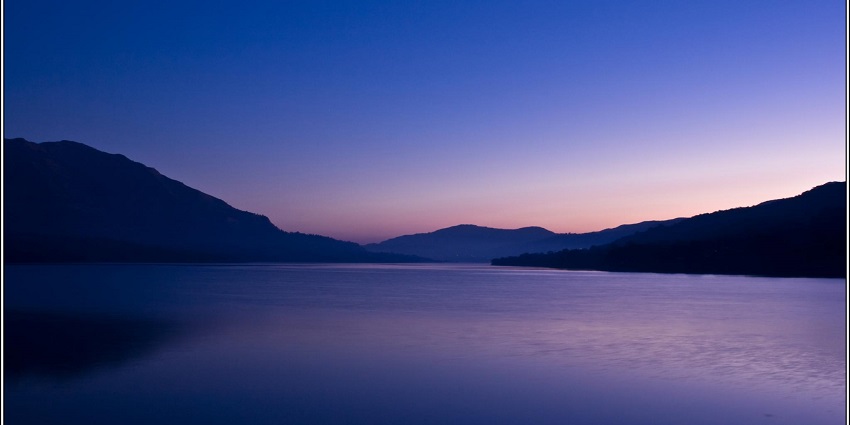 A beautiful sunrise over Mulshi Dam, a popular destination near Tamhini Waterfall.