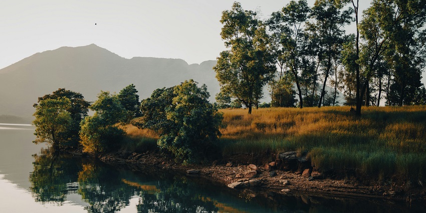 Serene Mulshi Lake nestled among hills, one of the best places to visit in Mulshi.