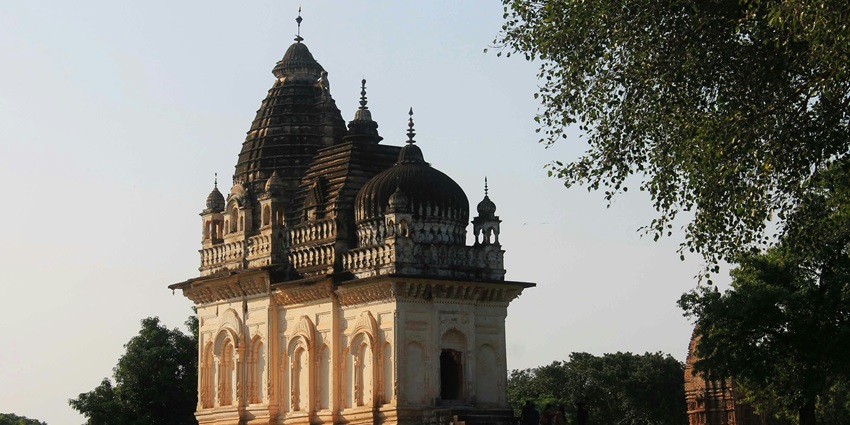 A glimpse of the famous Mumbadevi Temple surrounded by lush green vegetation.