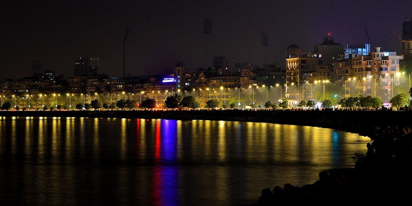 Vibrant nightlife in Mumbai, showcasing lively streets, bustling clubs, and an illuminated skyline.