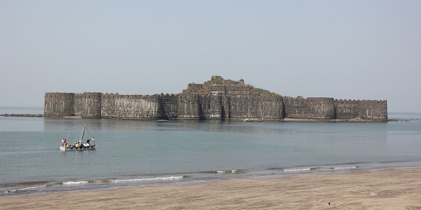 Scenic view of Murud-Janjira beaches with golden sands and calm waves under blue skies