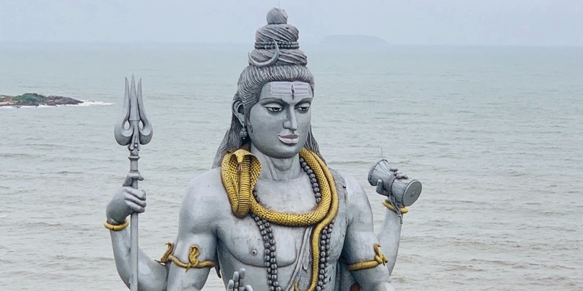 A coastal town featuring a towering Shiva statue and pristine beaches, one of the best places to visit in Karnataka in July.