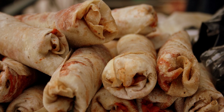 An image of spicy mutton rolls wrapped in flaky pastry, a delicious treat in Pondicherry.