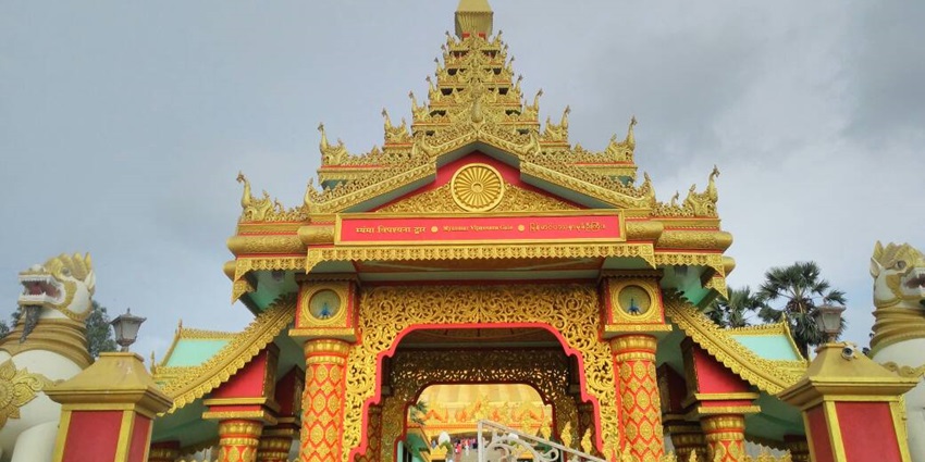 A glimpse of the Myanmar Gate adorned with vibrant shades and rustic charm.