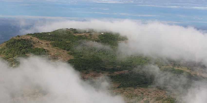 The peaceful hill station has misty weather, trekking, paragliding, and scenic views.