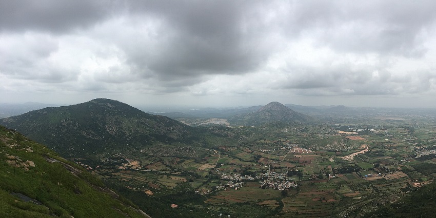 A picture capturing the beautiful Nandi Hills with trekking paths and lush surroundings.
