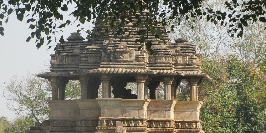 Wide angle view of the Nandi temple surrounded by tall trees