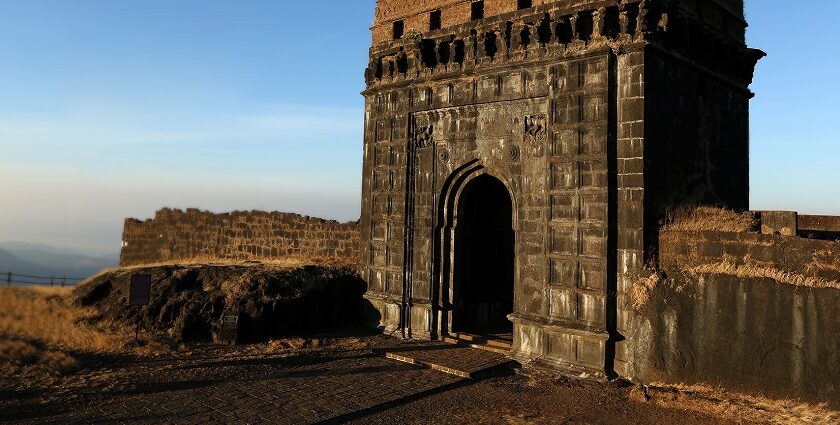 Narayangad Fort in Maharashtra is surrounded by lush greenery and mountains.