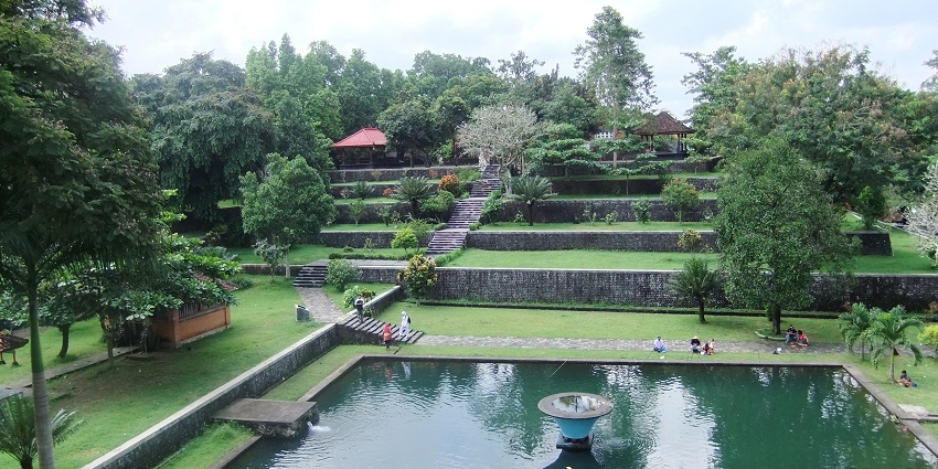 Lush greenery, serene water pond, vibrant flowers, peaceful retreat.