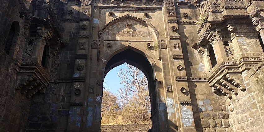 Narnala Fort set against the backdrop of Melghat National Park's green hills.