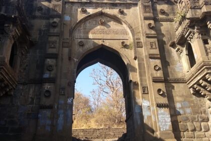 Narnala Fort, surrounded by greenery under a clear sky, showcasing ancient architecture