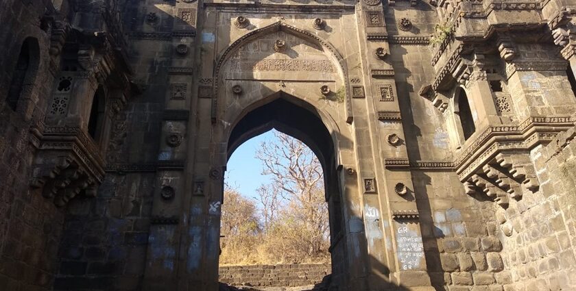 Narnala Fort, surrounded by greenery under a clear sky, showcasing ancient architecture