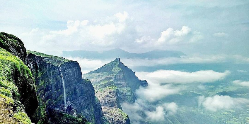 A scenic picture of Ram Ghat, where visitors are taking a spiritual dip in the cold water.