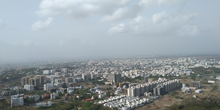 An View of Nashik skyline showcasing buildings from Trirashmi Hill, a tourist attraction near Thanale Caves.