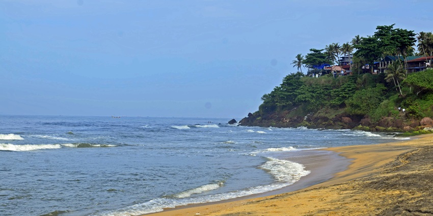 Scenic beach with waves crashing, a popular spot among places to visit in Virar