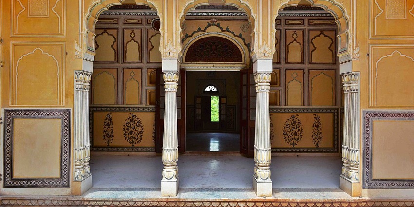 Gate inside the Nahargarh Fort with traditional architecture and yellow wall designs.