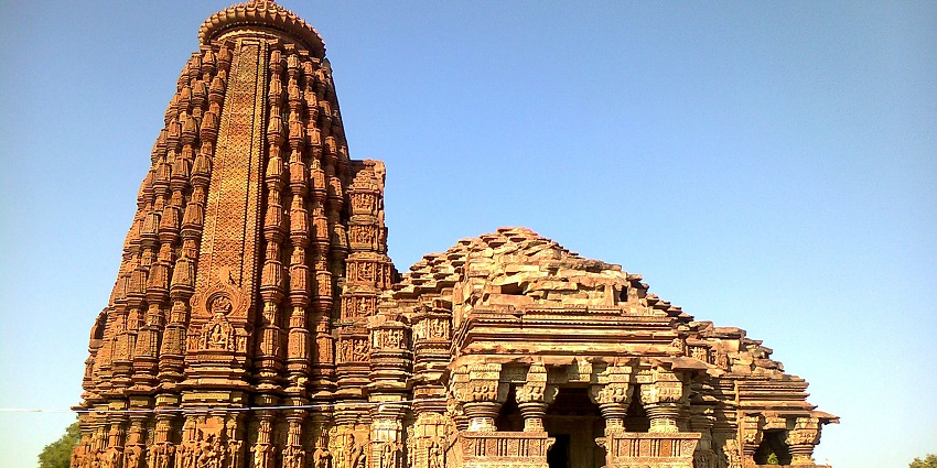 A picture of a temple with traditional architecture and intricate wall carvings