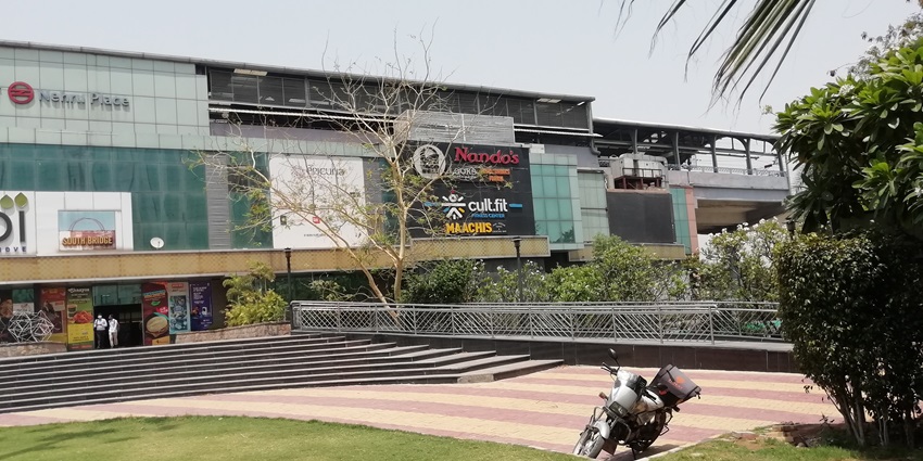 Nehru Place Metro Station in Delhi, with the Lotus Temple accessible nearby.
