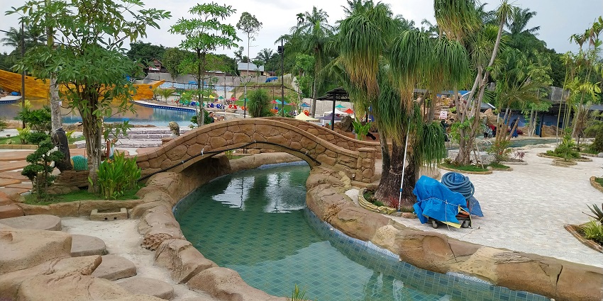Image of adventure park with water slides and other rides - fun time for family and friends