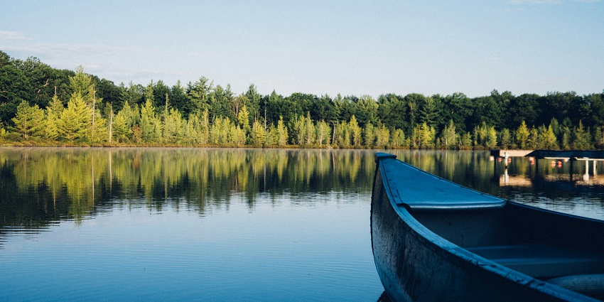 Nirgaon Lake features serene waters, lush greenery, perfect for picnics.