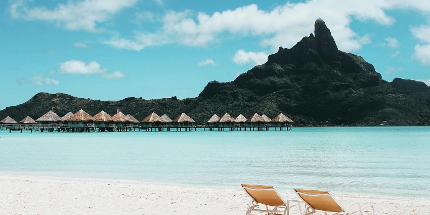 A tranquil sight of Nivati Beach with gentle waves touching the shore.