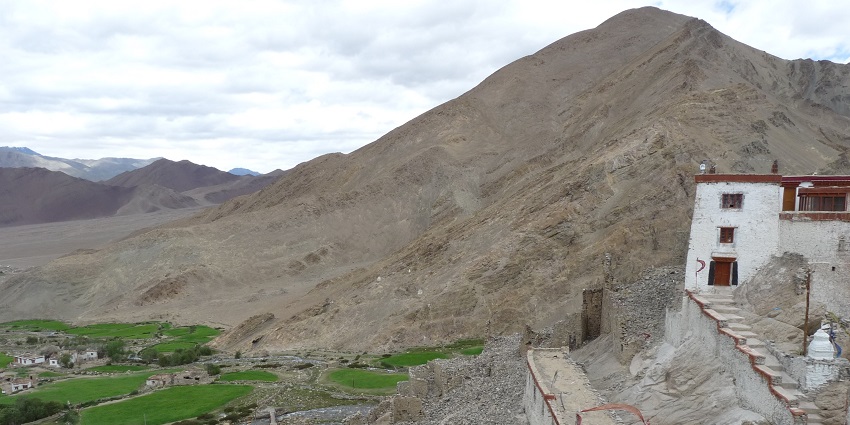 A picture of a monastery in Ladakh, perched on top of a mountain