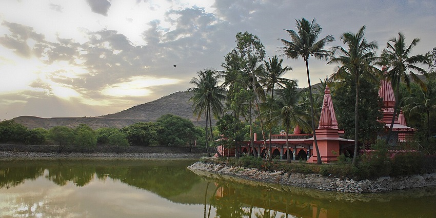 A serene view of Ramdara Temple, surrounded by nature and reflecting tranquility.