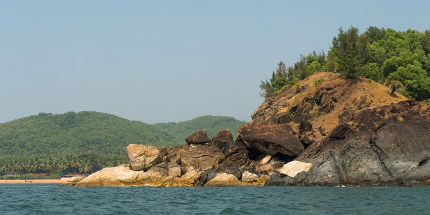 Unwind at Om Beach, Gokarna, a must-visit among the famous beaches in Karnataka.