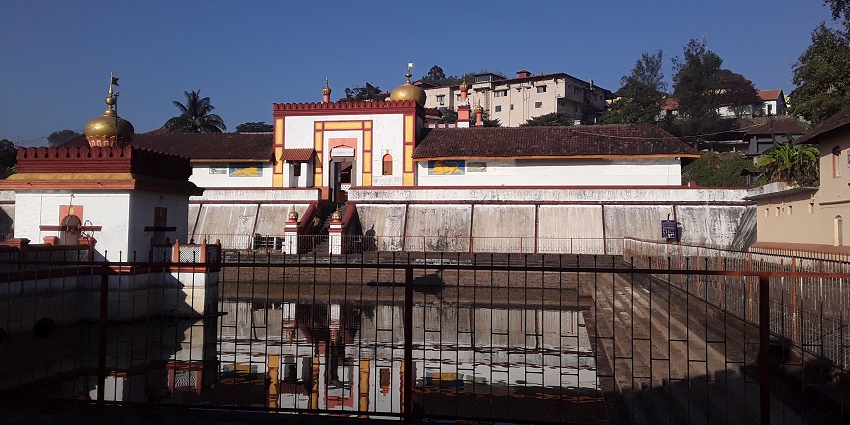 The temple tank of Omkareshwara Temple in Madikeri, reflects the architecture.