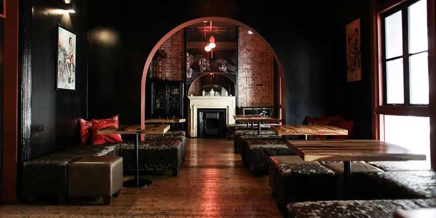 A picture of a restobar with comfortable seating arrangements and a cosy ambience