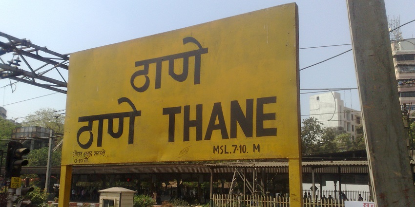 Thane railway station near Tansa Wildlife Sanctuary showing platforms, tracks, and passengers.