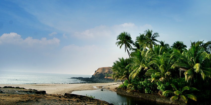 Panoramic snapshot of the beach with the clear blue waters of Ocean near Shrivardhan Fort