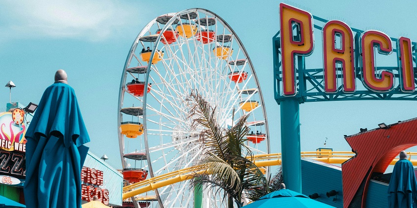 View of the vibrant thrilling rides inside the park including ferris wheel and rollercoaster