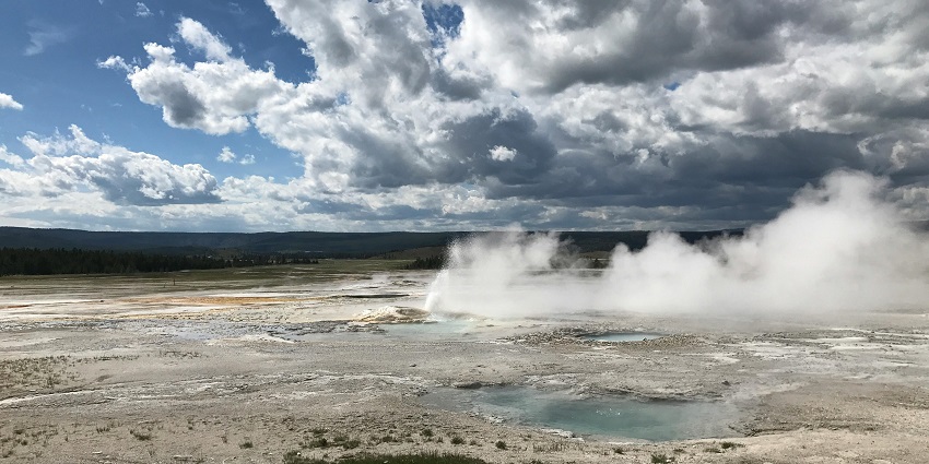 Scenic view of the puga hot springs, offerings panoramic views of the mountain ranges around