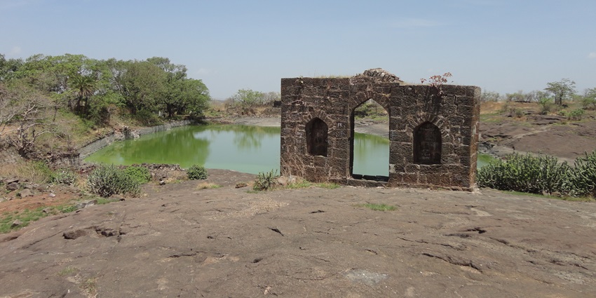 Bastion of Narnala Fort showcasing historic architecture against a backdrop of blue skies