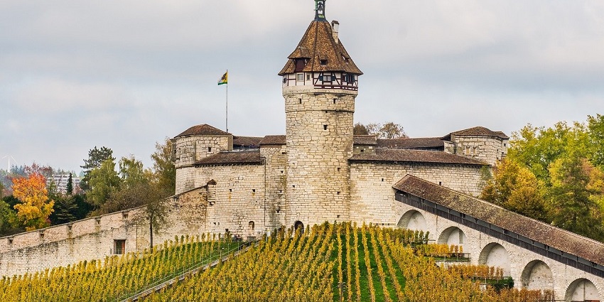 Castle fortress stands tall against a clear sky, showcasing its historic architecture.