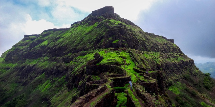 Panoramic view of Torna Fort from Zunzar Machi, showcasing the surrounding landscape.