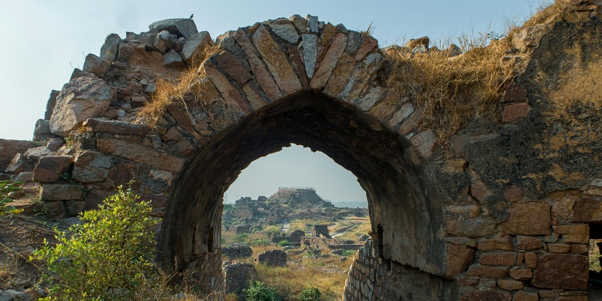 Fort ruins with stone, surrounde dby lush greenery Ahmednagar, Maharashtra