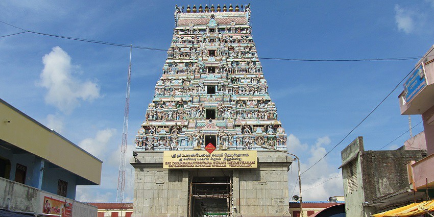 View of the temple surrounded by many pilgrims and tourists