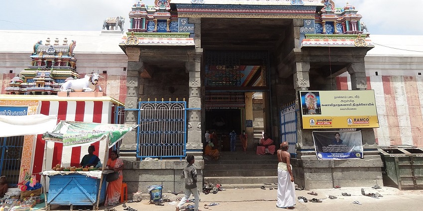 A frontal view of the temple entrance with a Gopuram on top
