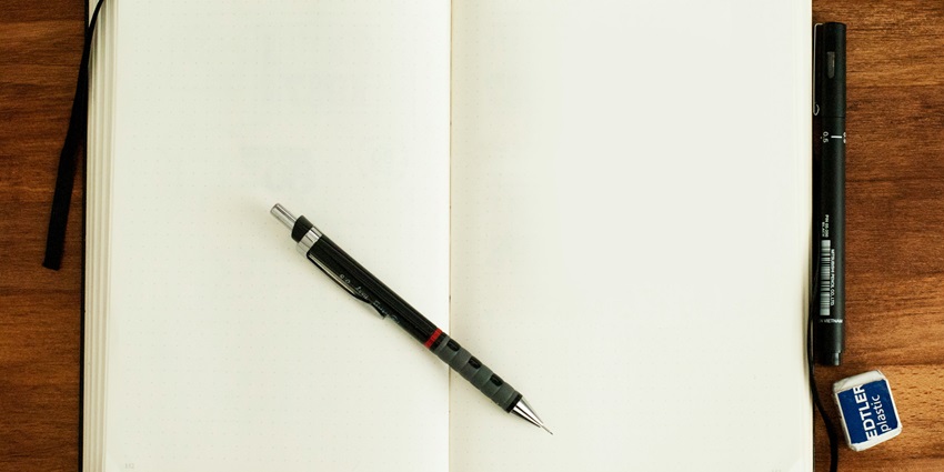 A marvellous view of an open notebook with a pen on it showcasing factors to consider.