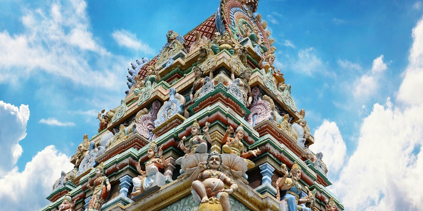 Panoramic image of the beautiful Hindu temple and its walls full of idols of deities.