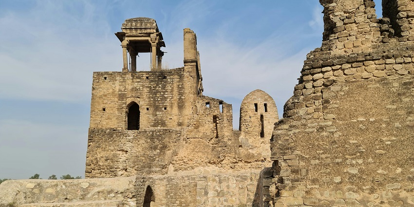 View of brownstone fort buildings under a clear blue sky, showcasing ancient architecture